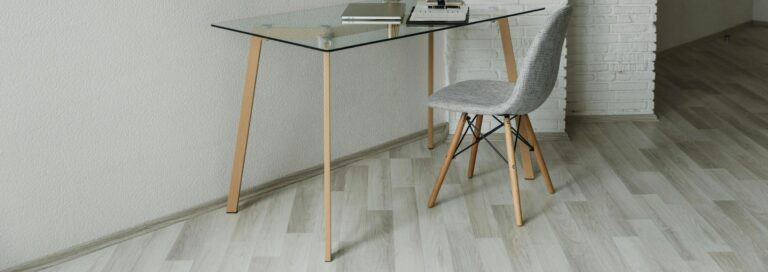 Gray Chair Near a Glass Table